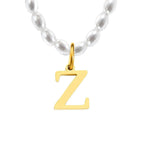 Elara · Collar de perlas con inicial