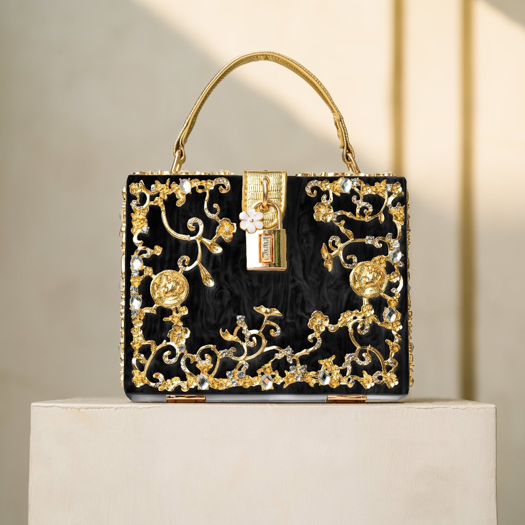 Vittoria · Bolso box de acrílico con detalle floral dorado