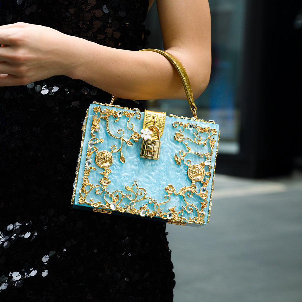 Vittoria · Bolso box de acrílico con detalle floral dorado