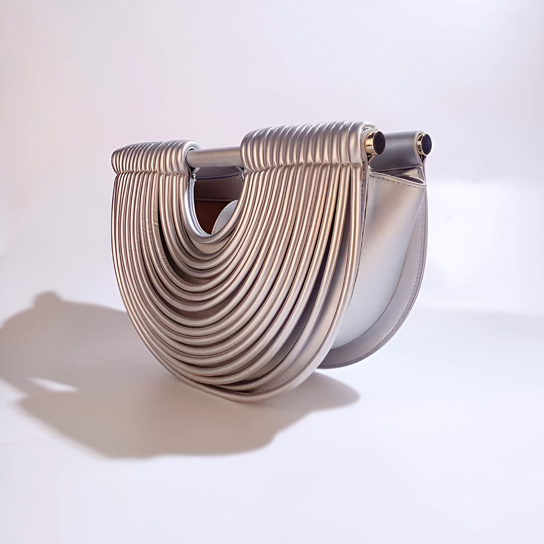 Seren · Bolso de mano semicircular con acabado metálico