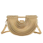 Seren · Bolso de mano semicircular con acabado metálico