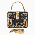 Vittoria · Bolso box de acrílico con detalle floral dorado