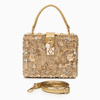 Vittoria · Bolso box de acrílico con detalle floral dorado