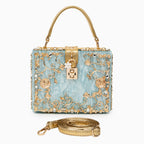 Vittoria · Bolso box de acrílico con detalle floral dorado