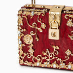 Vittoria · Bolso box de acrílico con detalle floral dorado