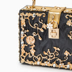 Vittoria · Bolso box de acrílico con detalle floral dorado