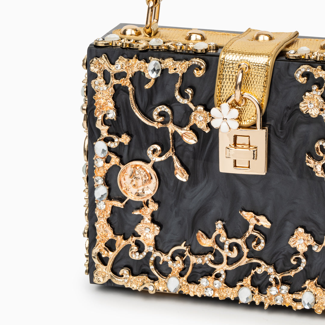 Vittoria · Bolso box de acrílico con detalle floral dorado