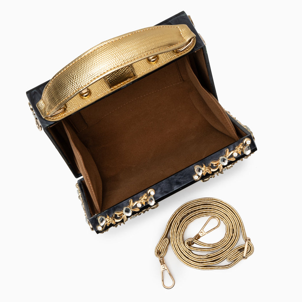 Vittoria · Bolso box de acrílico con detalle floral dorado