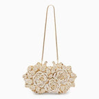 Luna Spark · Clutch con strass y nudo decorativo