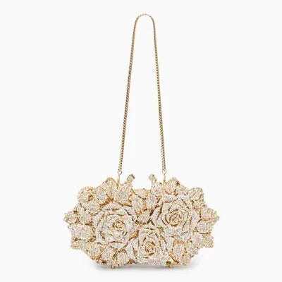 Luna Spark · Clutch con strass y nudo decorativo