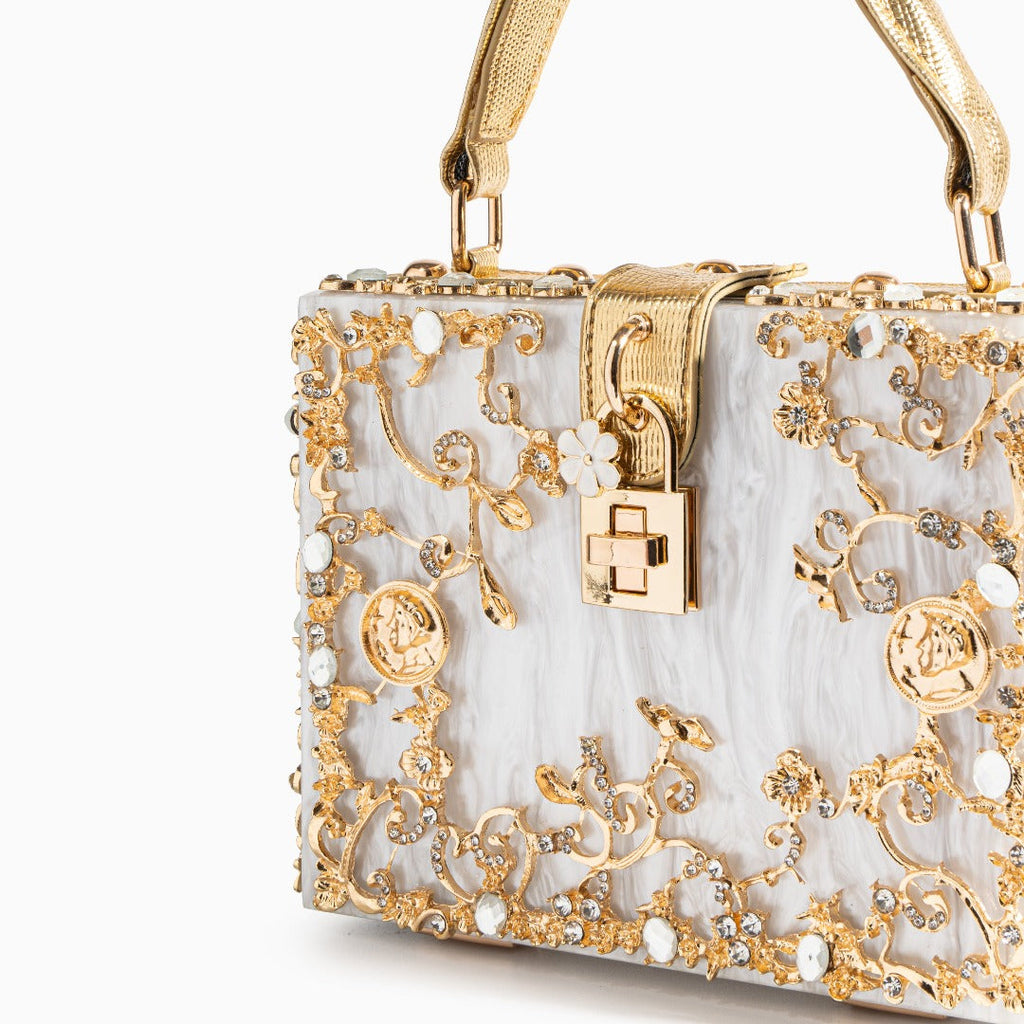 Vittoria · Bolso box de acrílico con detalle floral dorado