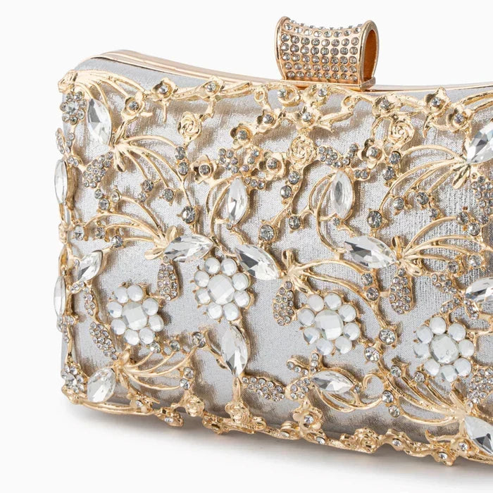 Ema · Clutch con strass y detalle de nudo