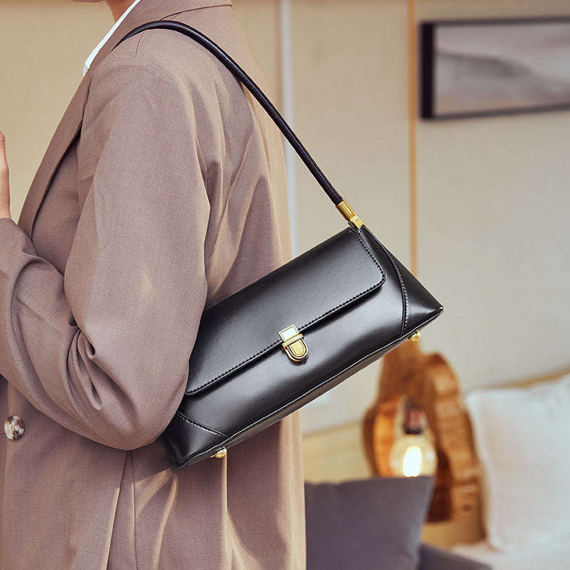 Camilla · Bolso compacto con asa superior