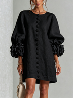 Kiera · Vestido corto negro con puños florales, vista frontal