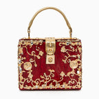 Vittoria · Bolso box de acrílico con detalle floral dorado