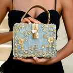Vittoria · Bolso box de acrílico con detalle floral dorado