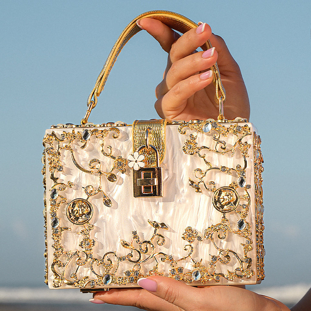 Vittoria · Bolso box de acrílico con detalle floral dorado
