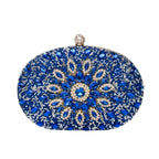Celeste · Clutch con strass y detalle de nudo