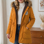 Lena · Parka con capucha y ribete de pelo en mostaza